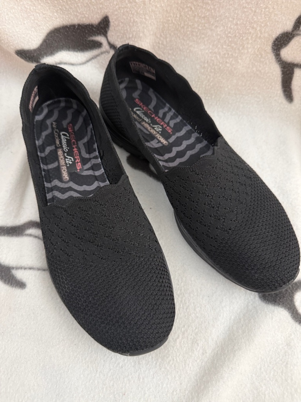 Skechers Women's Black Knit Slip-On Sneakers